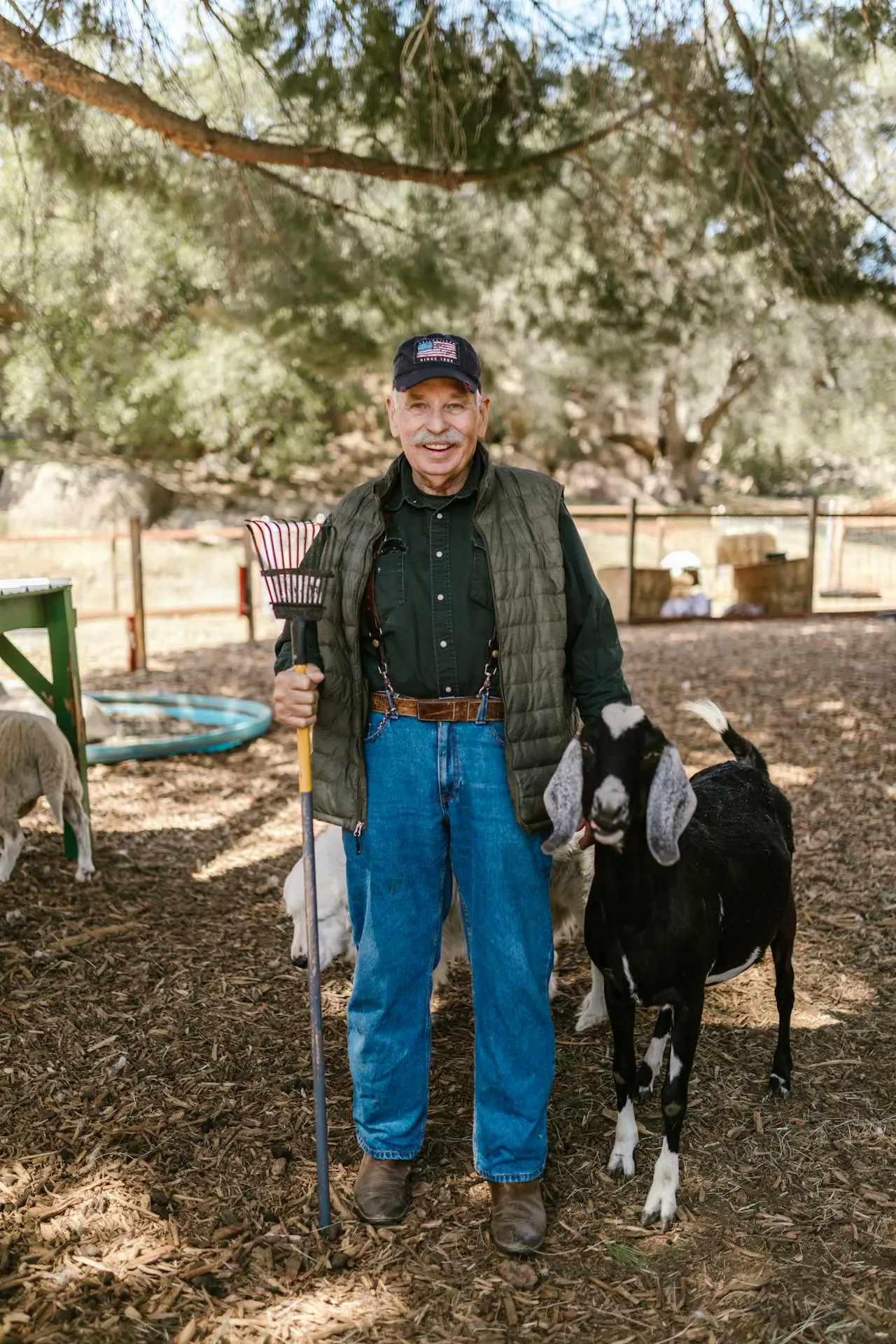 A caretaker with one of the goats at Inner Peace and Happiness Ranch